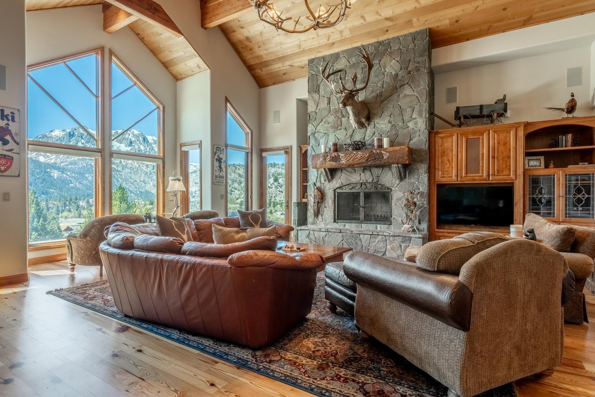 45 Skyline Road June Lake, CA 93529 - Photo 8 of 58 a living room with furniture large window and fireplace