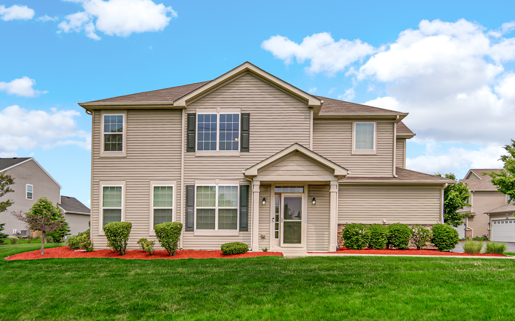 192 Owen Street Matteson, IL 60443 - Photo 2 of 2 a front view of a house with a yard and potted plants