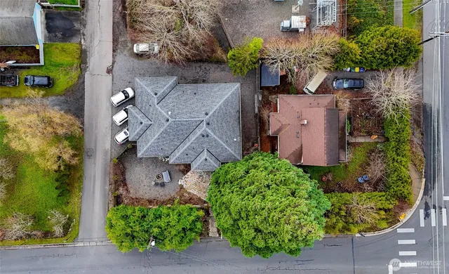 an aerial view of a house with a yard and garden