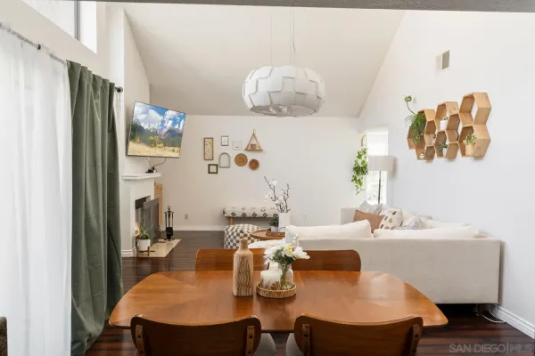 a dining room with furniture and window