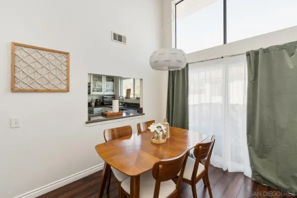a view of a dining room with furniture window and wooden floor