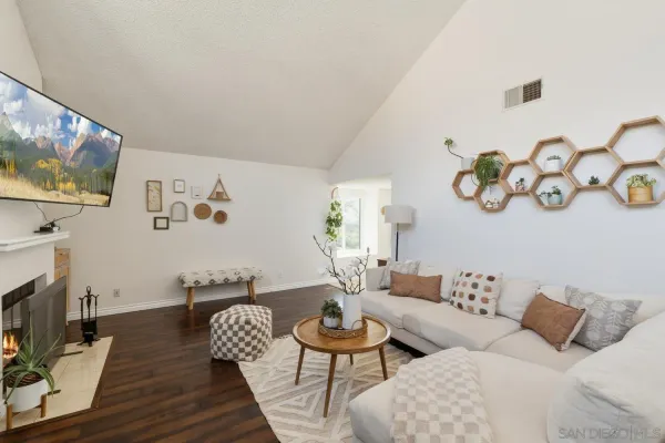 a living room with furniture and a flat screen tv