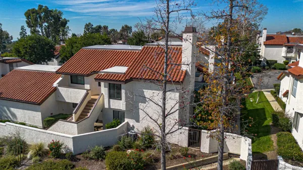 an aerial view of a house with outdoor space