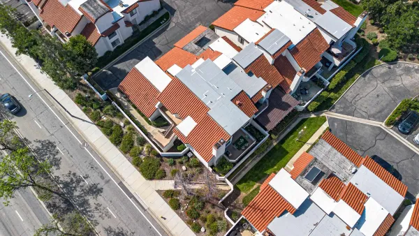 a view of multiple houses with yard