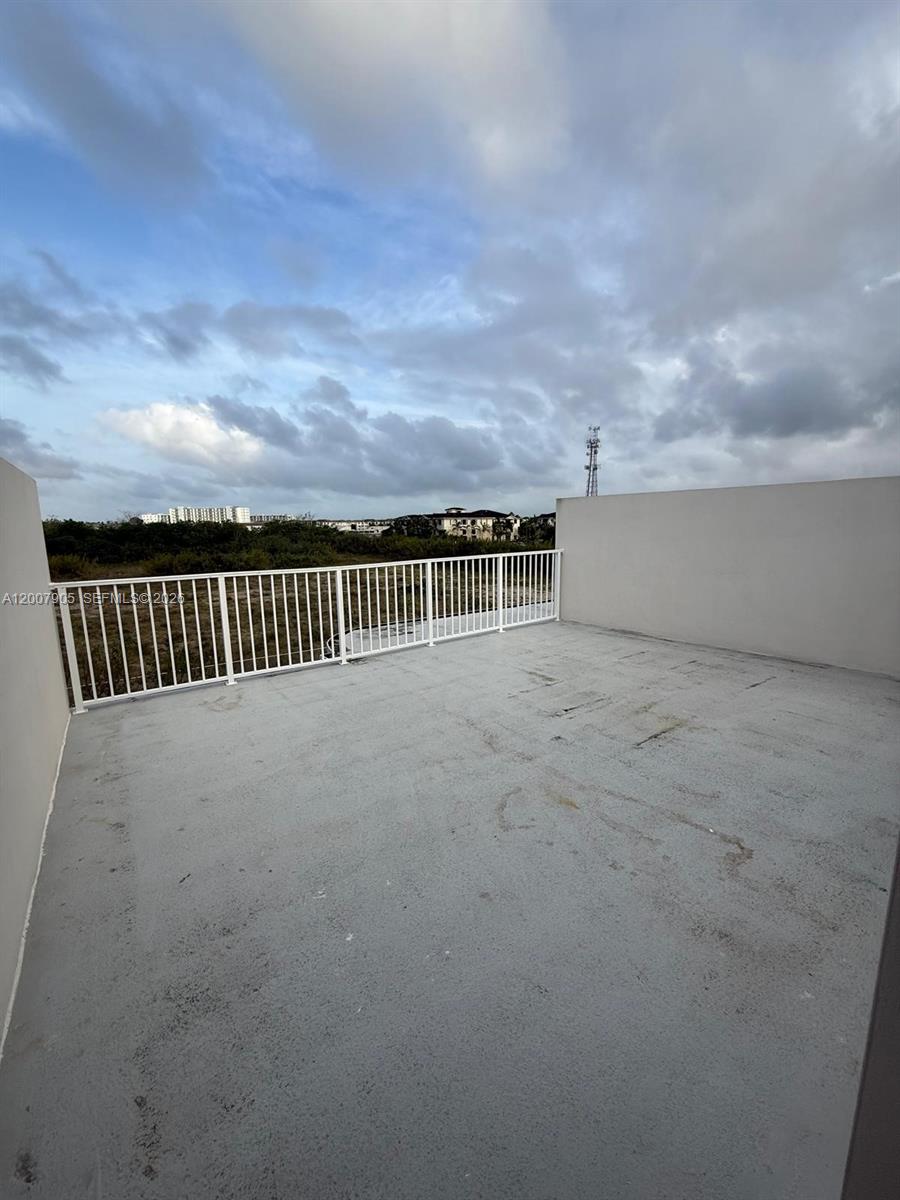 25664 Southwest 143rd Path, Unit 25664 Homestead, FL 33032 - Photo 14 of 17 a view of a terrace