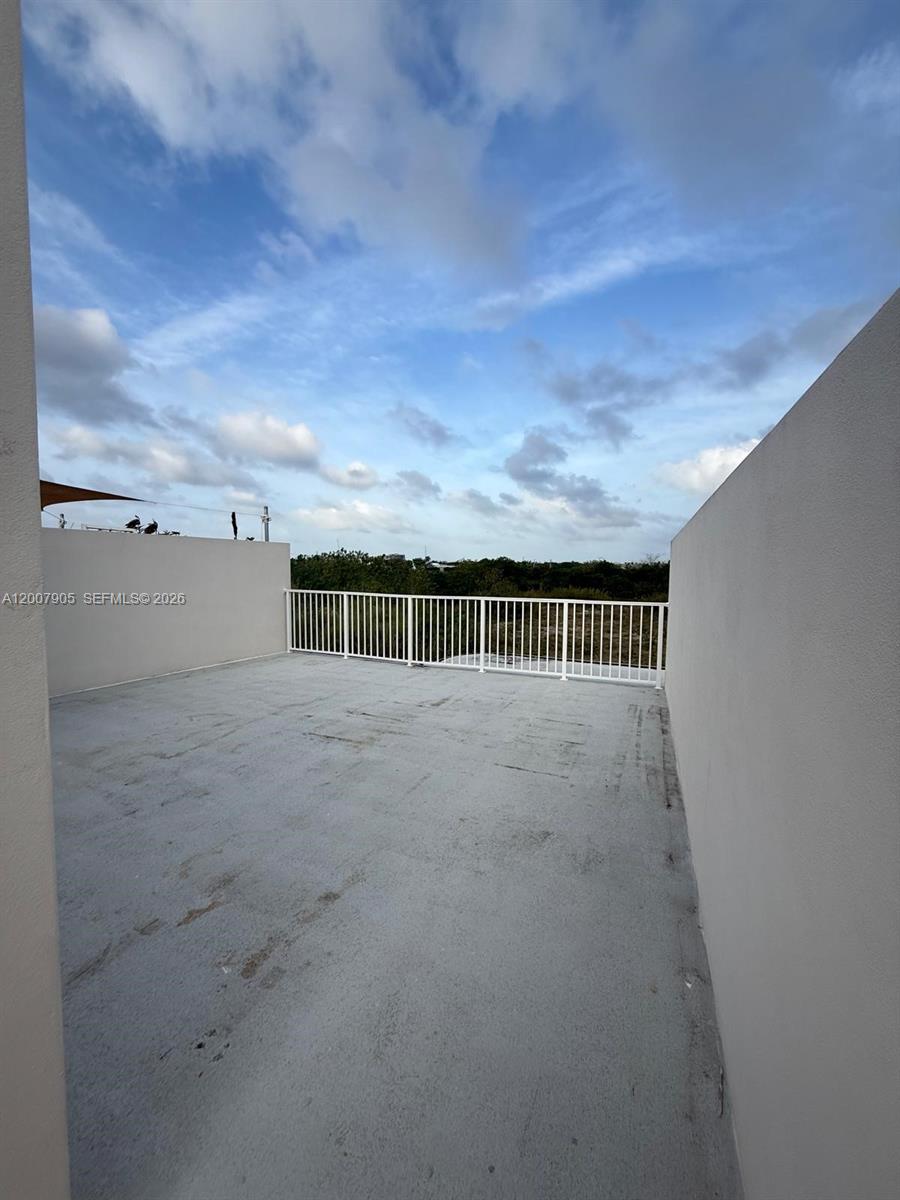 25664 Southwest 143rd Path, Unit 25664 Homestead, FL 33032 - Photo 15 of 17 a view of terrace with sky view