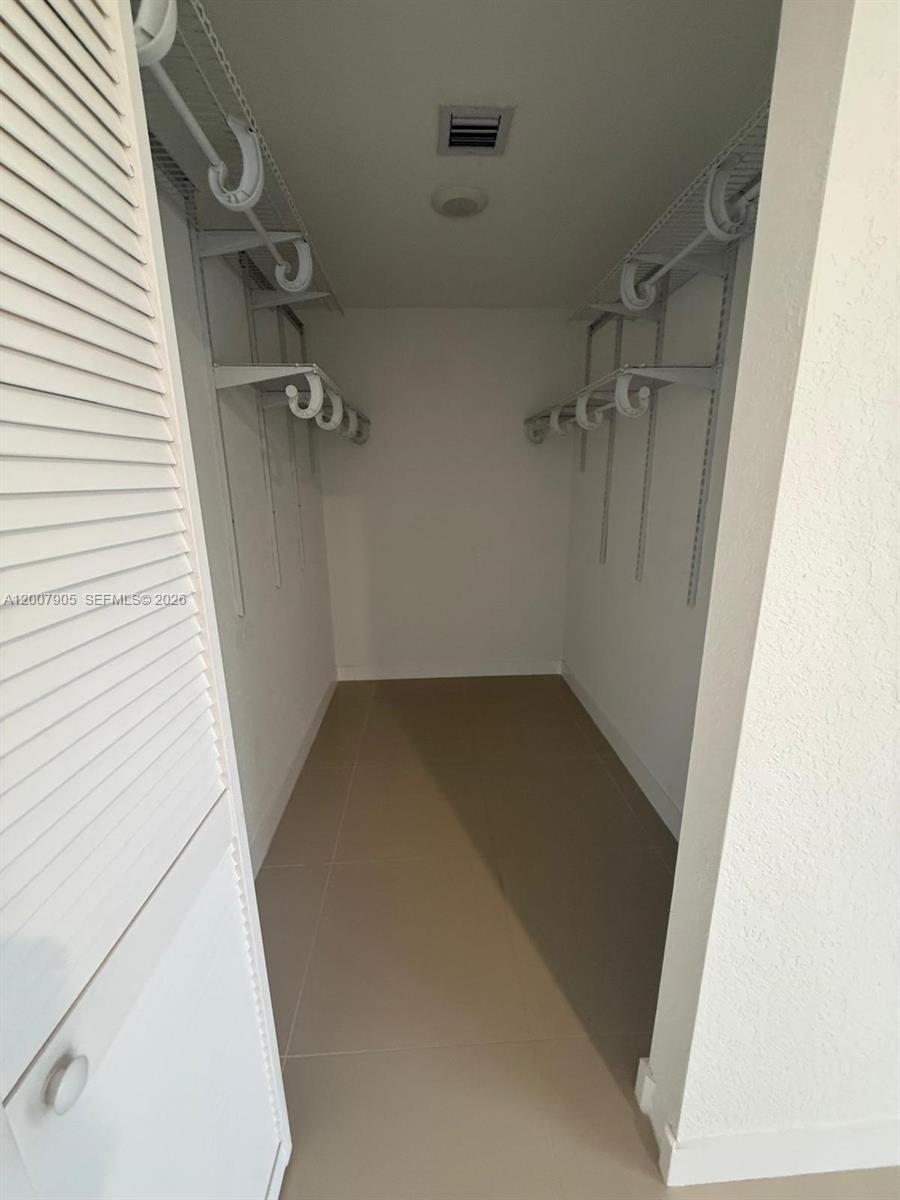 25664 Southwest 143rd Path, Unit 25664 Homestead, FL 33032 - Photo 6 of 17 view of a room with door