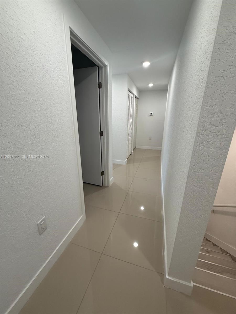 25664 Southwest 143rd Path, Unit 25664 Homestead, FL 33032 - Photo 9 of 17 a view of hallway