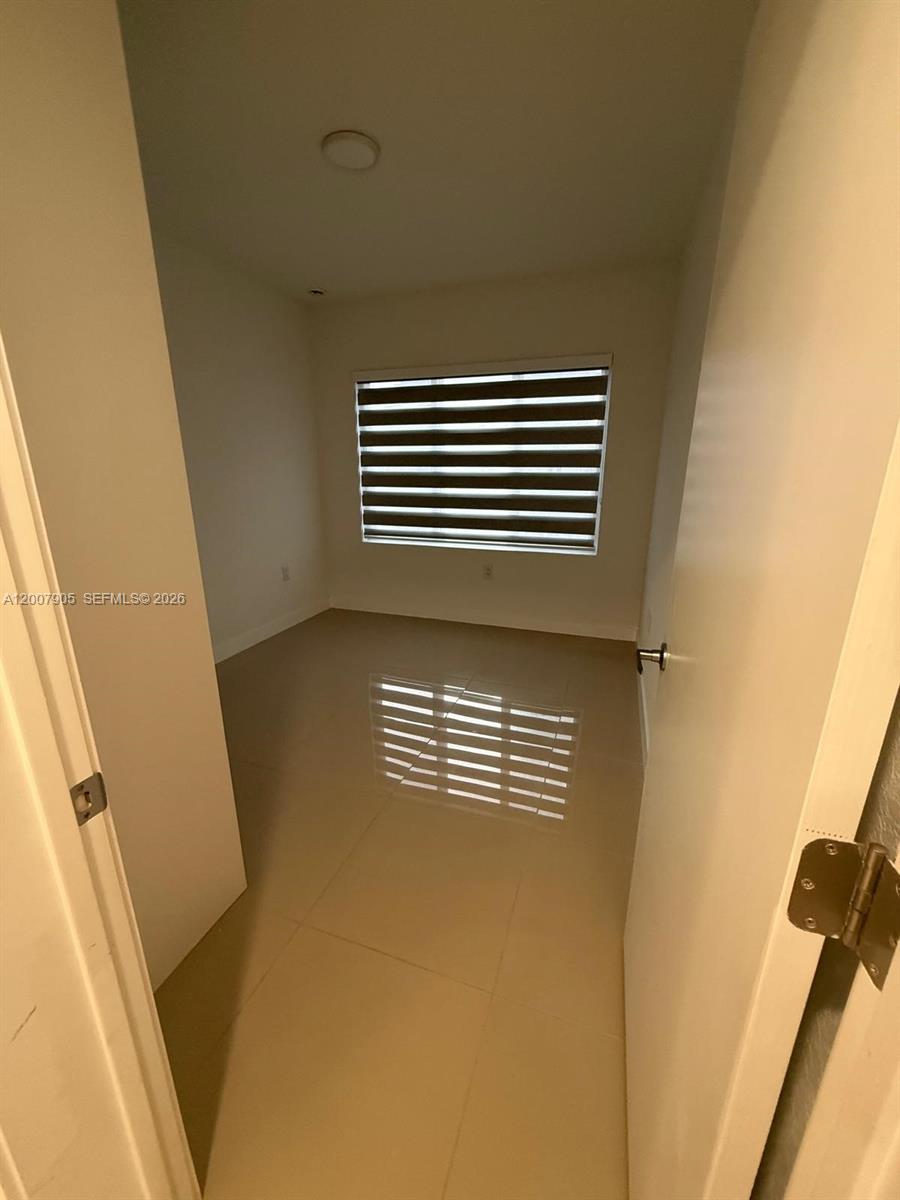 25664 Southwest 143rd Path, Unit 25664 Homestead, FL 33032 - Photo 10 of 17 a view of outdoor space and deck