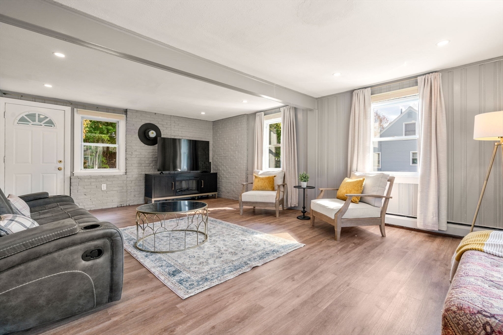 381 Main Street Saugus, MA 01906 - Photo 11 of 31 a living room with furniture and a flat screen tv