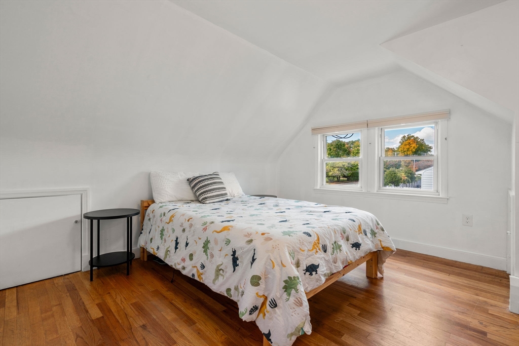 381 Main Street Saugus, MA 01906 - Photo 15 of 31 a bedroom with a bed and a window