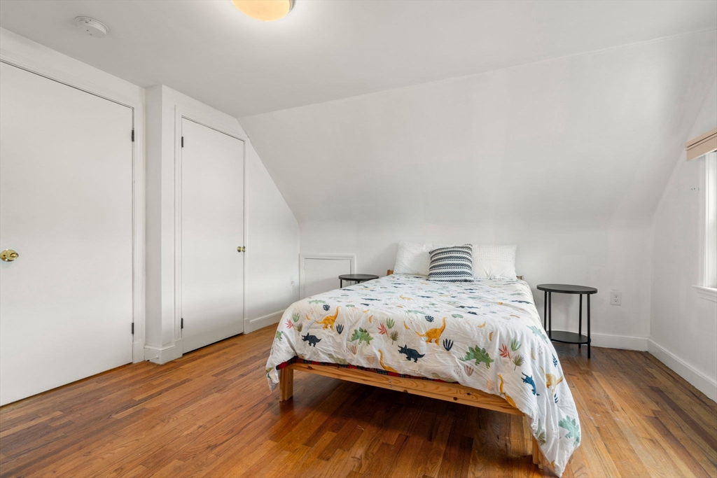 381 Main Street Saugus, MA 01906 - Photo 16 of 31 a bedroom with a bed and wooden floor