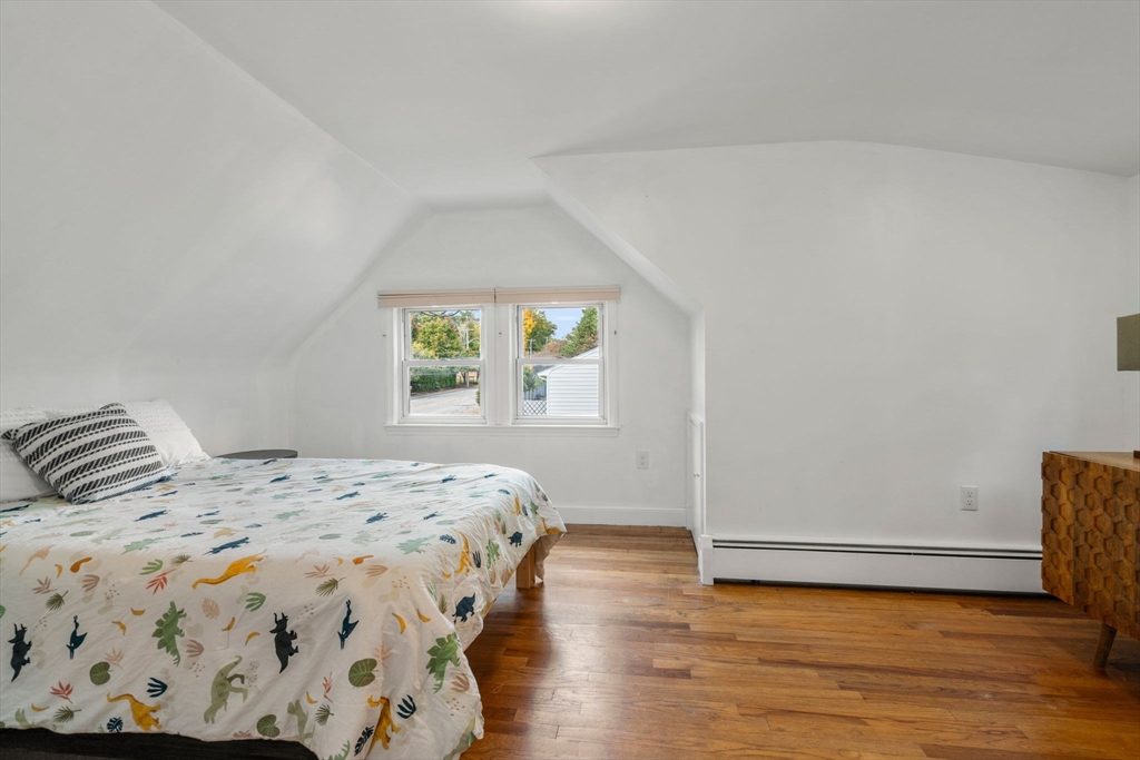 381 Main Street Saugus, MA 01906 - Photo 17 of 31 a bedroom with a bed and a window