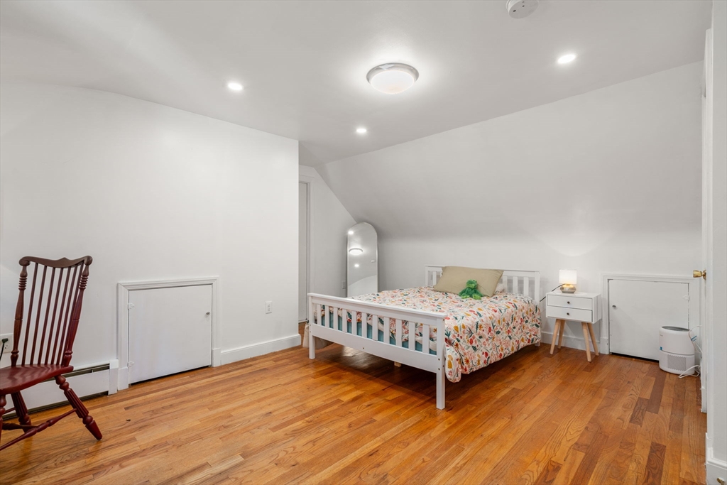 381 Main Street Saugus, MA 01906 - Photo 24 of 31 a room with a bed window and a chair