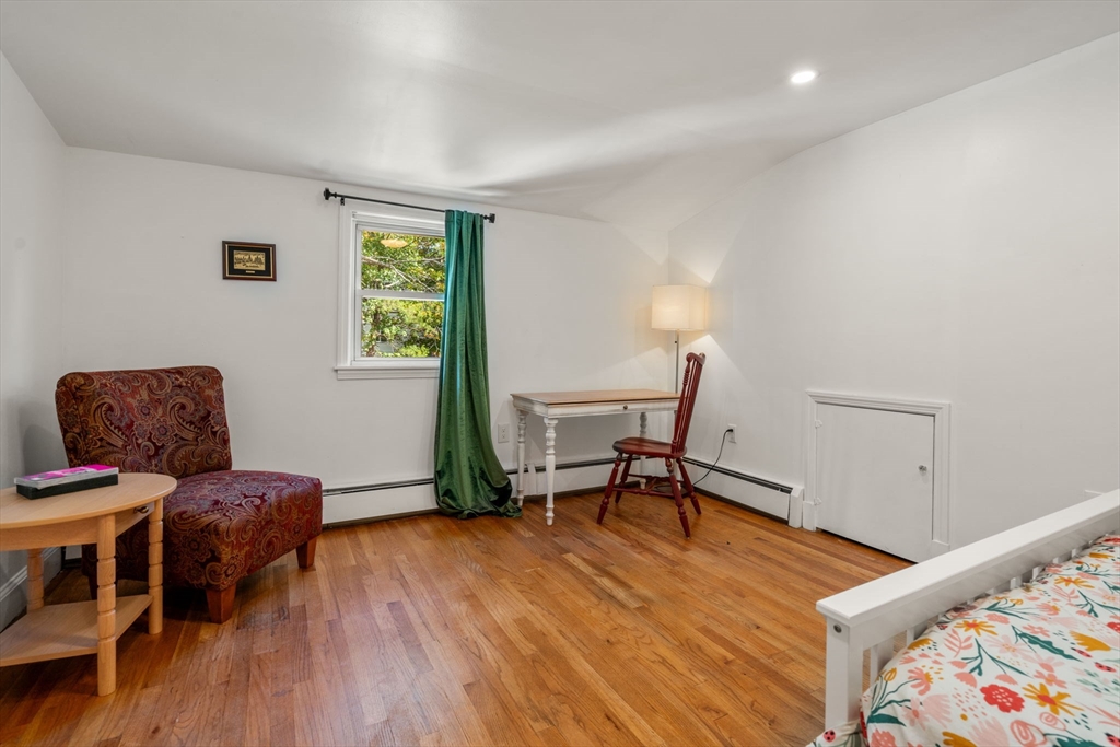 381 Main Street Saugus, MA 01906 - Photo 26 of 31 a living room with furniture and a wooden floor