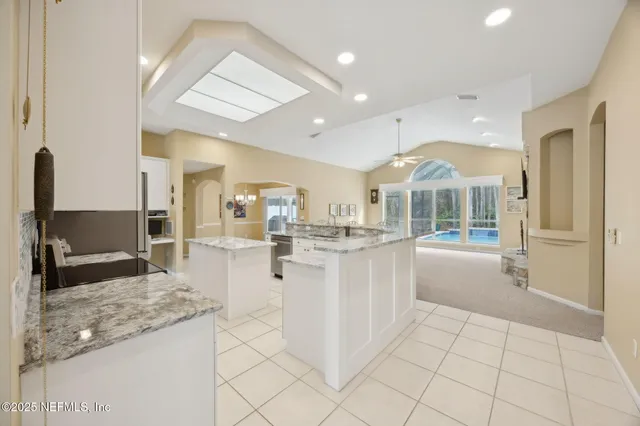 a view of an empty room with a ceiling fan