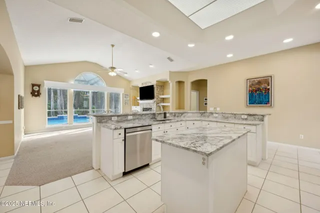 a spacious bathroom with a bathtub and a shower