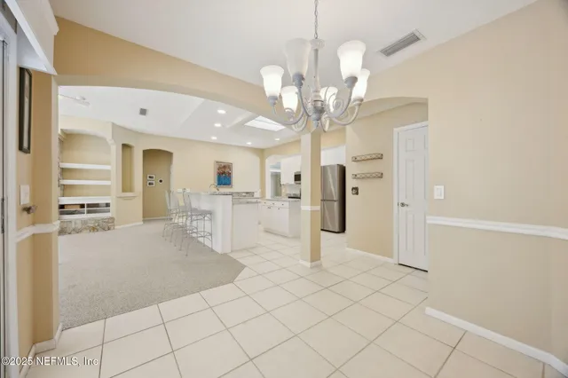 a view of a house with swimming pool and a yard