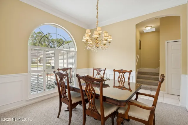 a view of a house with backyard patio and swimming pool