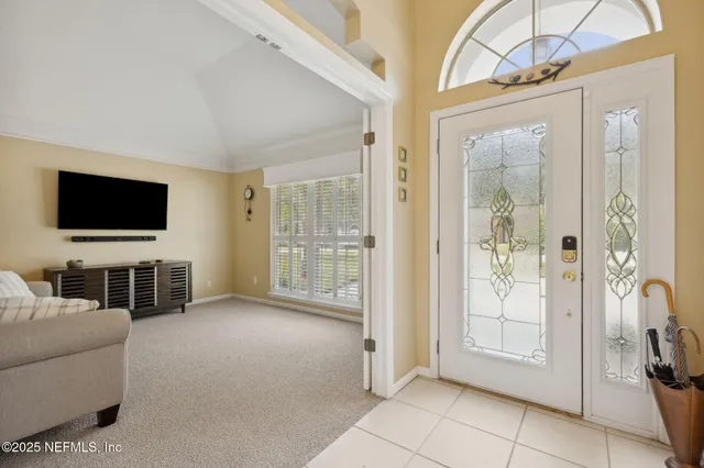 a kitchen with stainless steel appliances kitchen island granite countertop a refrigerator and cabinets