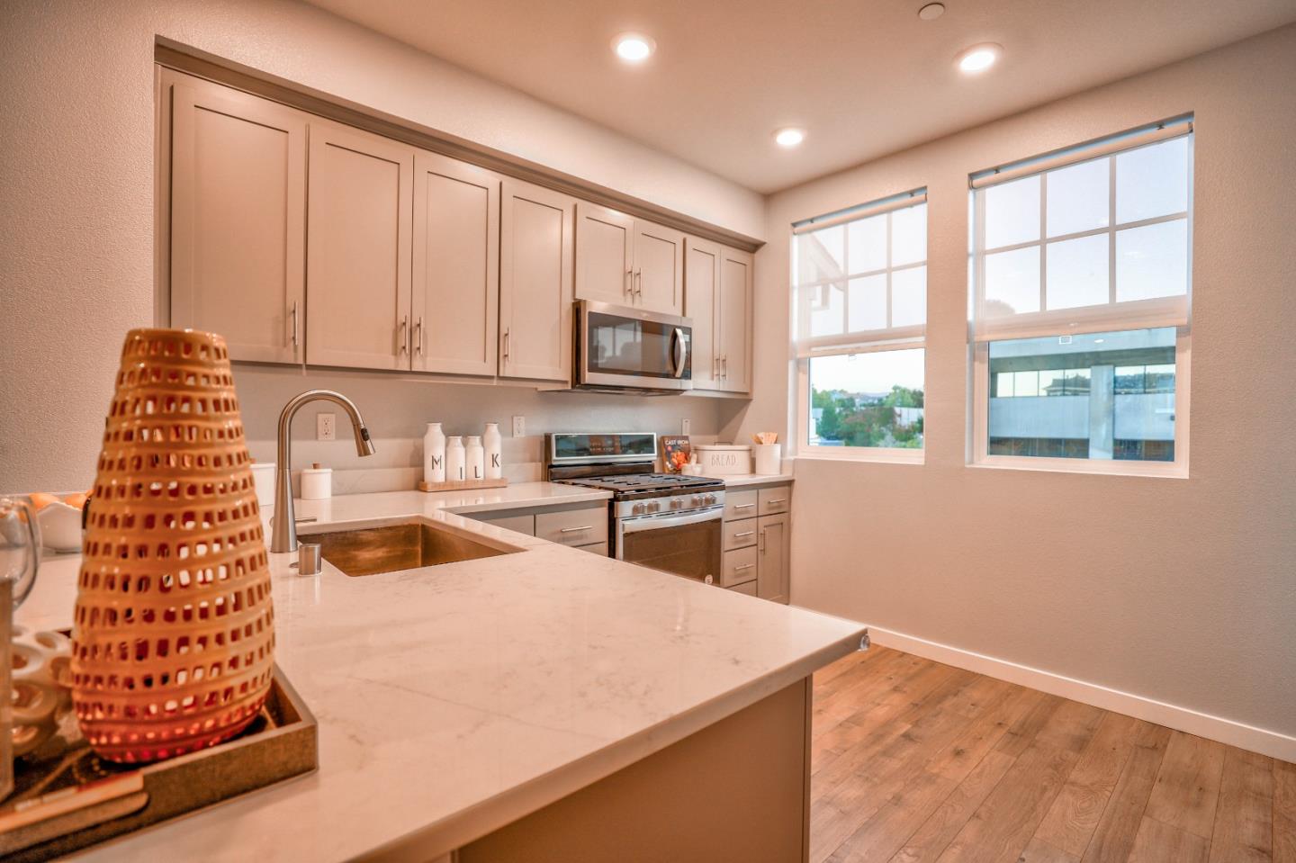 3856 Domain Way Mountain View, CA 94043 - Photo 16 of 39 a kitchen with granite countertop a stove a sink and a microwave