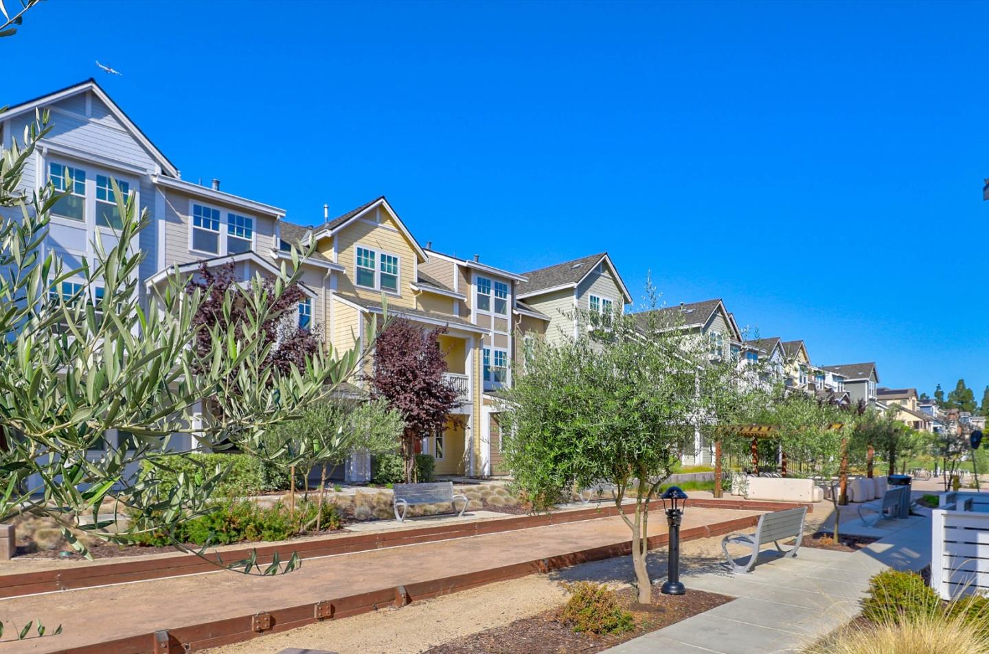 3856 Domain Way Mountain View, CA 94043 - Photo 2 of 39 a front view of a house with a yard and potted plants