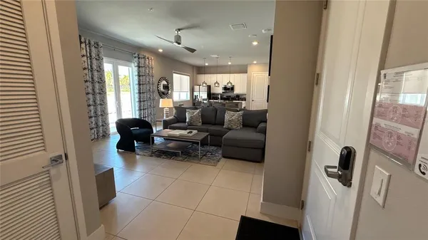 a living room with furniture and a large window