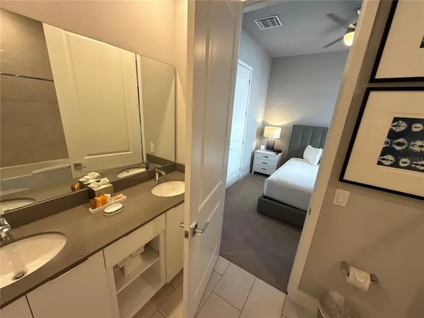 a view of a bathroom from a corridor