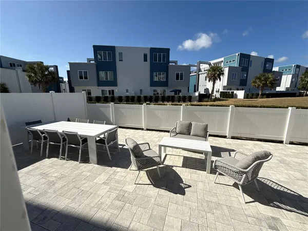 a view of a chairs and table in patio