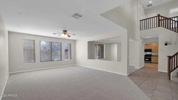 an empty room with windows and closet