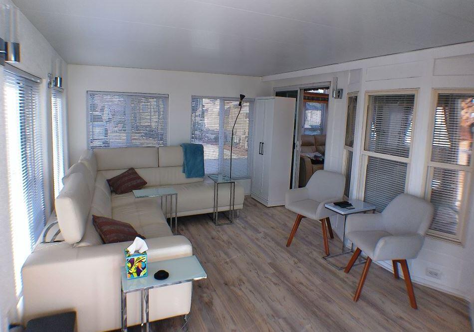 84136 Ave 44, Unit 150 Indio, CA 92203 - Photo 11 of 37 a living room with furniture and wooden floor