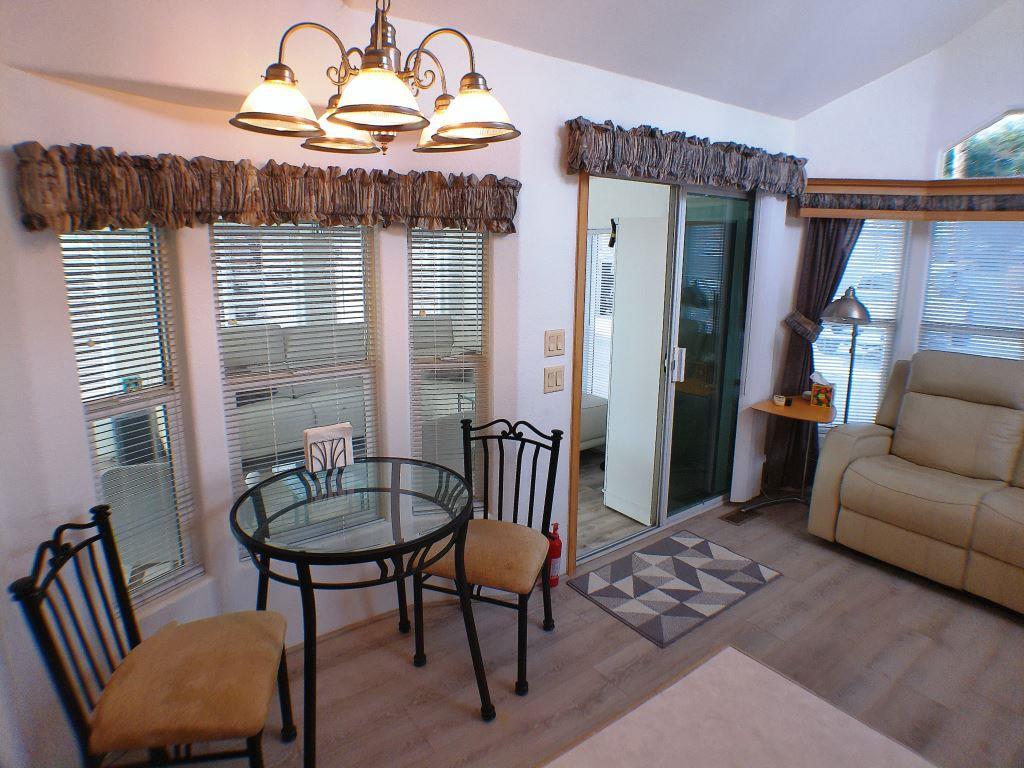 84136 Ave 44, Unit 150 Indio, CA 92203 - Photo 13 of 37 a view of a livingroom with furniture and a dining table