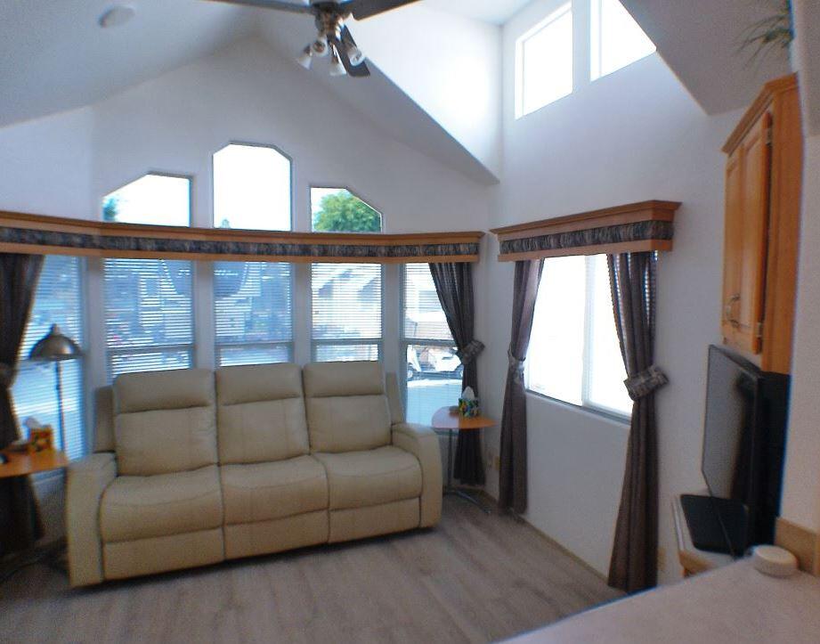 84136 Ave 44, Unit 150 Indio, CA 92203 - Photo 15 of 37 a living room with furniture and a large window