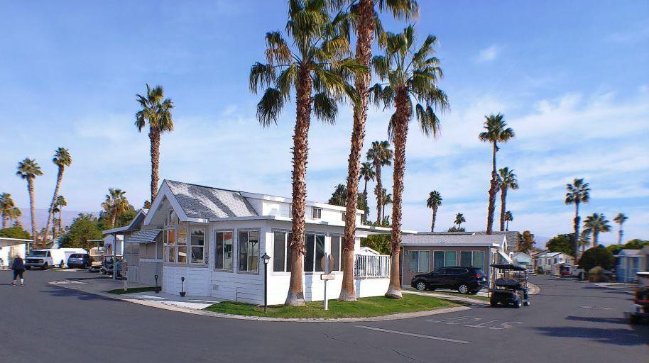 84136 Ave 44, Unit 150 Indio, CA 92203 - Photo 2 of 37 a view of multiple houses with a street