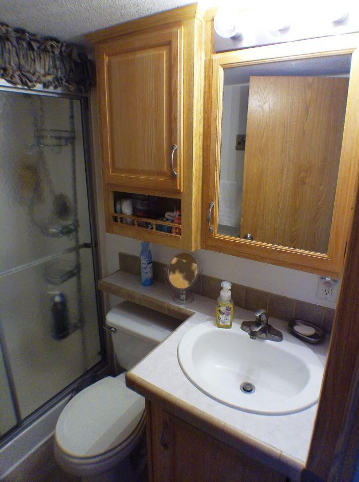 84136 Ave 44, Unit 150 Indio, CA 92203 - Photo 28 of 37 a bathroom with a sink a toilet and shower