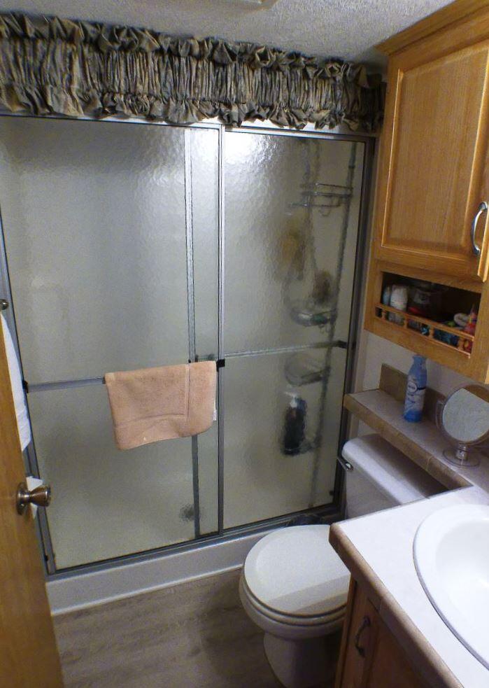 84136 Ave 44, Unit 150 Indio, CA 92203 - Photo 29 of 37 a bathroom with a sink and toilet