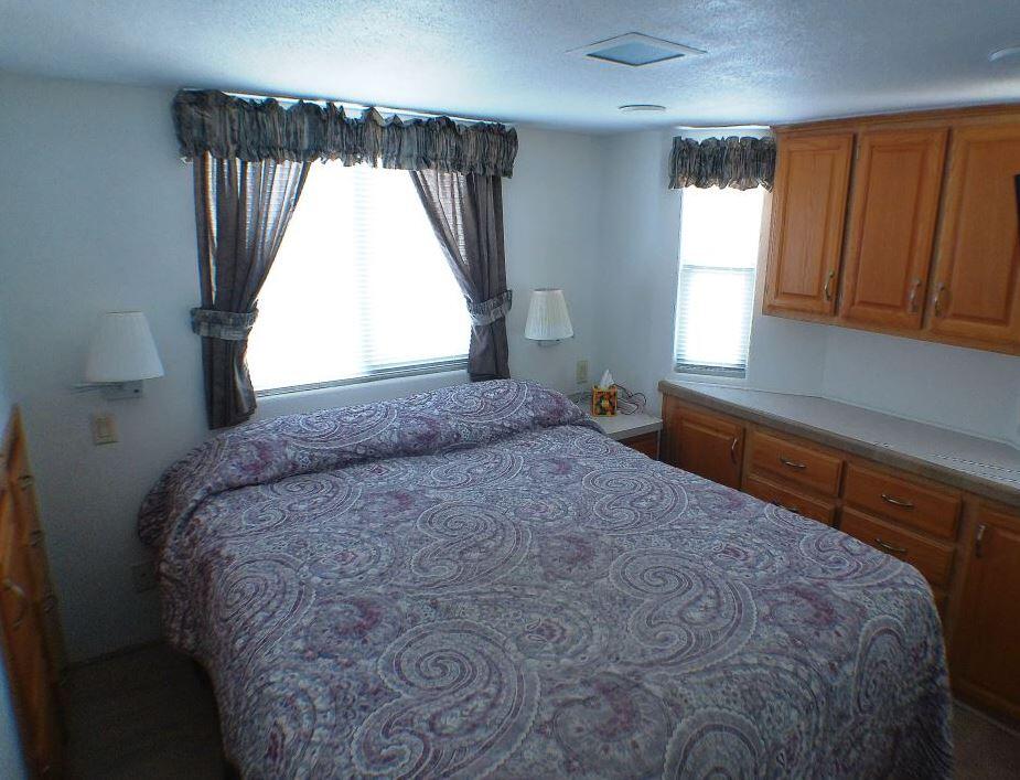 84136 Ave 44, Unit 150 Indio, CA 92203 - Photo 30 of 37 a bed sitting in a bedroom next to a window