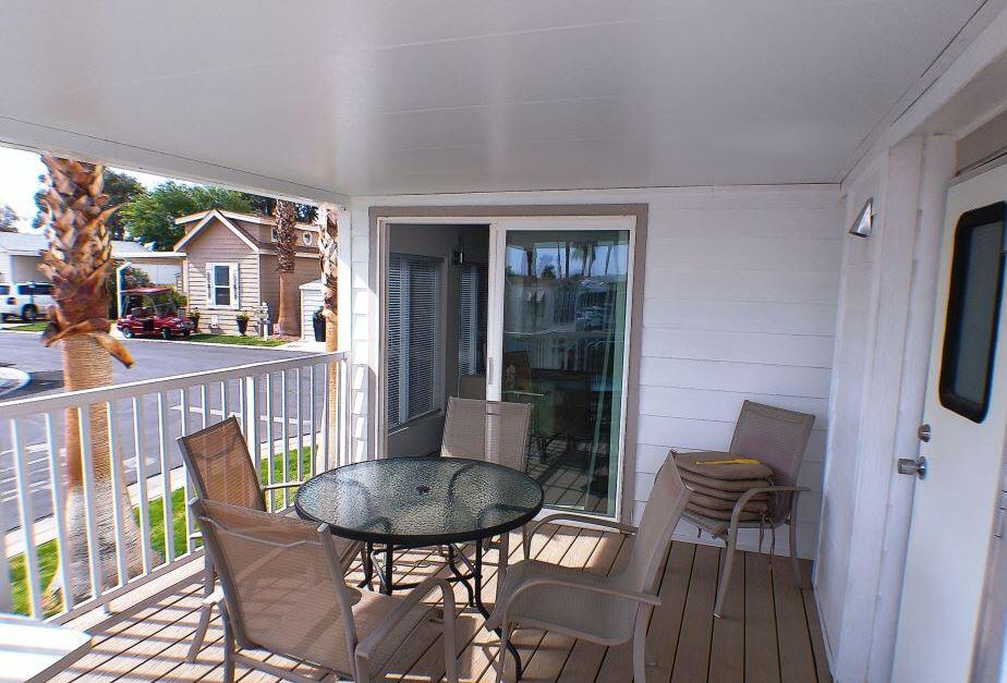 84136 Ave 44, Unit 150 Indio, CA 92203 - Photo 7 of 37 a view of a chair and table in the balcony