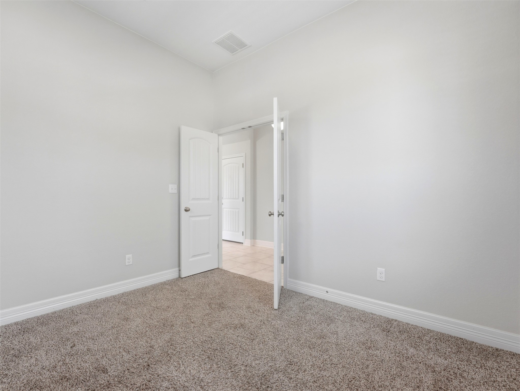 2132 Ringstaff Road Leander, TX 78641 - Photo 33 of 39 A well-proportioned interior space with light-toned walls and plush carpeting awaits your personal touch.