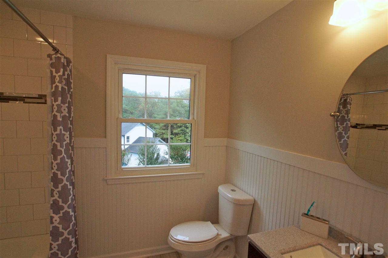 345 East Millbrook Road Raleigh, NC 27609 - Photo 20 of 24 CUSTOM TILE WORK PLUS NEW FLOORING, VANITY, AND LIGHTING!