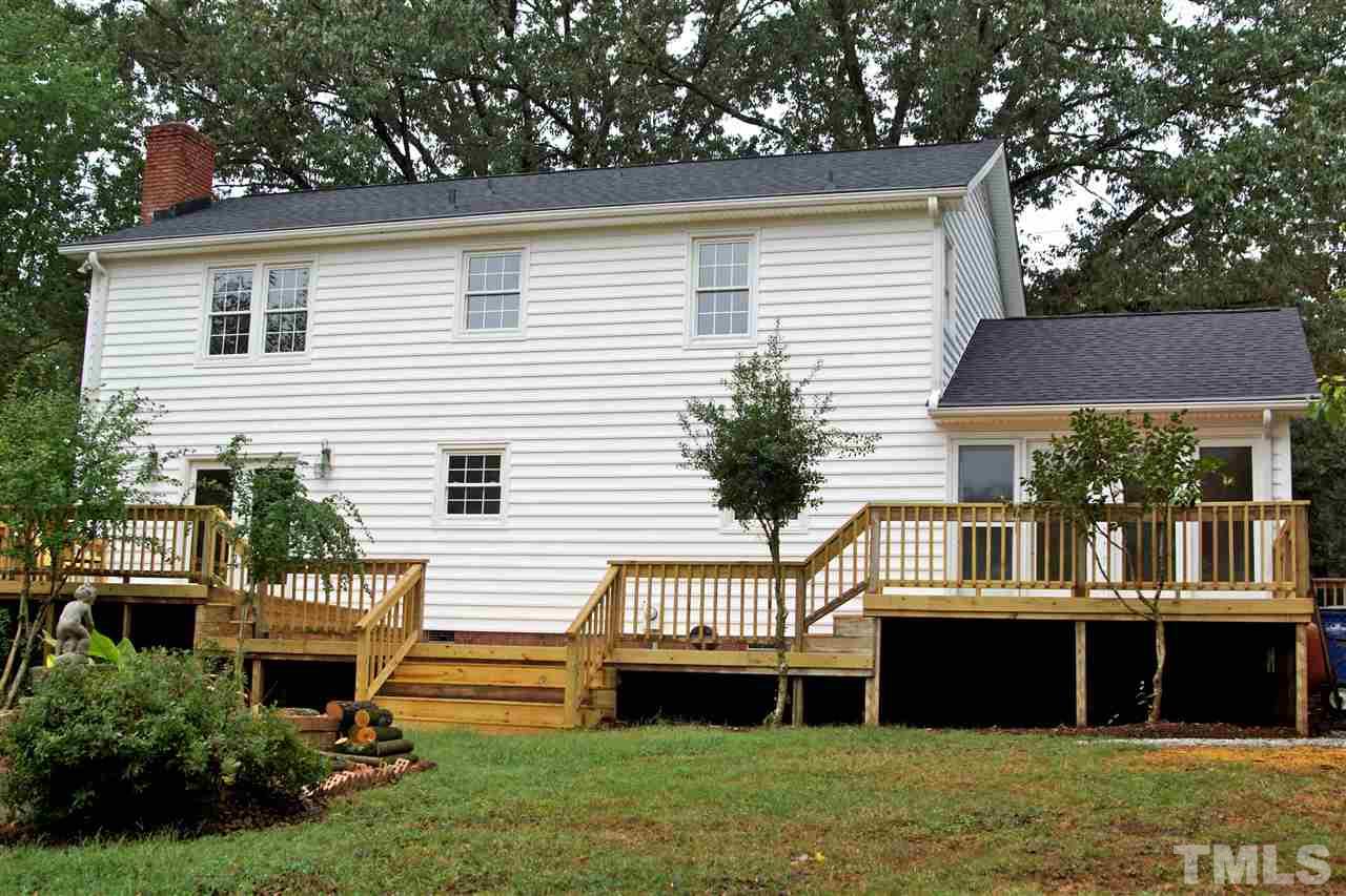 345 East Millbrook Road Raleigh, NC 27609 - Photo 4 of 24 OURDOOR LIVING AT IT'S FINEST! HUGE MULTI-LEVEL DECK WITH ACCESS FROM SUNROOM & FAMILY ROOM