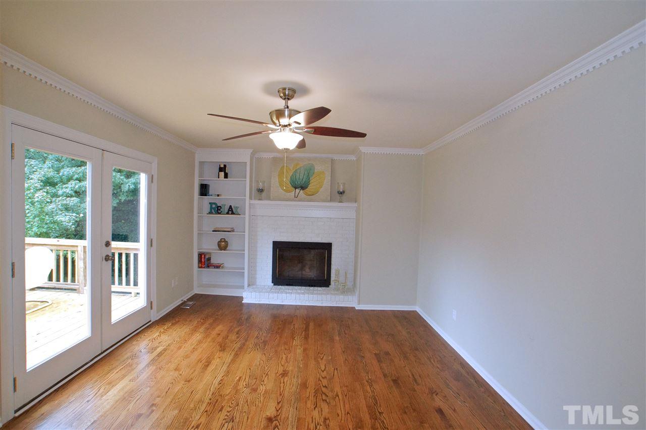345 East Millbrook Road Raleigh, NC 27609 - Photo 10 of 24 WITH GAS FIREPLACE & BUILT-INS, PLUS DOORWAY TO YOUR MULTI-LEVEL DECK!