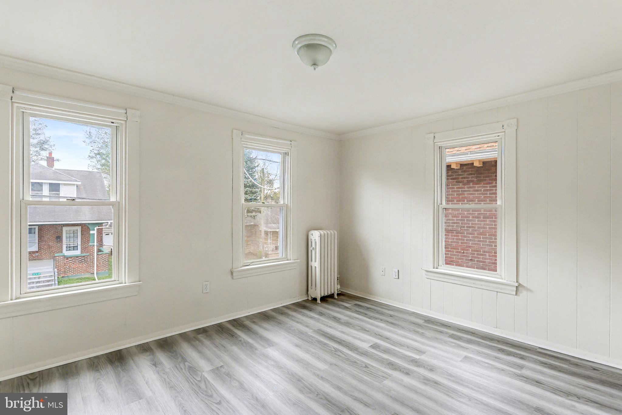 233 West Columbia Road Enola, PA 17025 - Photo 8 of 15 a view of empty room with wooden floor and fan