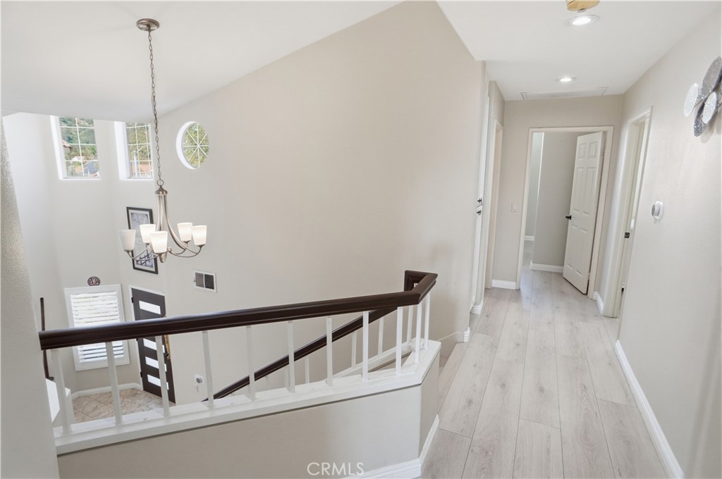 25550 Longfellow Place Stevenson Ranch, CA 91381 - Photo 15 of 30 a view of an entryway with wooden floor