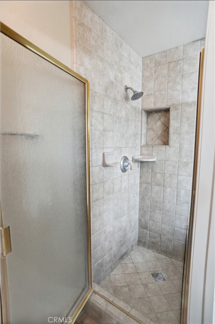 25550 Longfellow Place Stevenson Ranch, CA 91381 - Photo 20 of 30 a bathroom with a shower