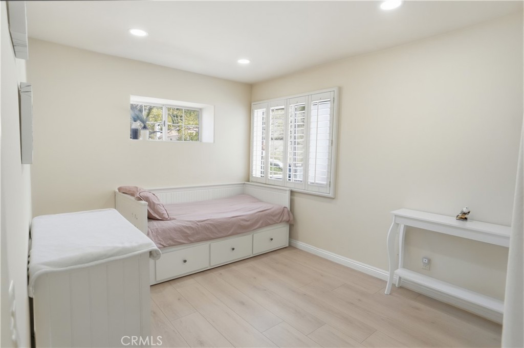 25550 Longfellow Place Stevenson Ranch, CA 91381 - Photo 22 of 30 a living room with furniture and a window