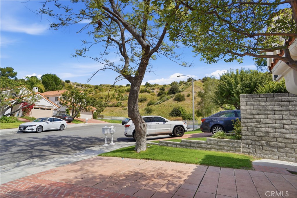 25550 Longfellow Place Stevenson Ranch, CA 91381 - Photo 27 of 30 a view of street with parked cars