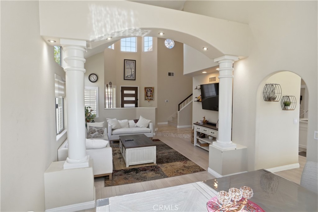 25550 Longfellow Place Stevenson Ranch, CA 91381 - Photo 5 of 30 a living room with fireplace furniture and a flat screen tv