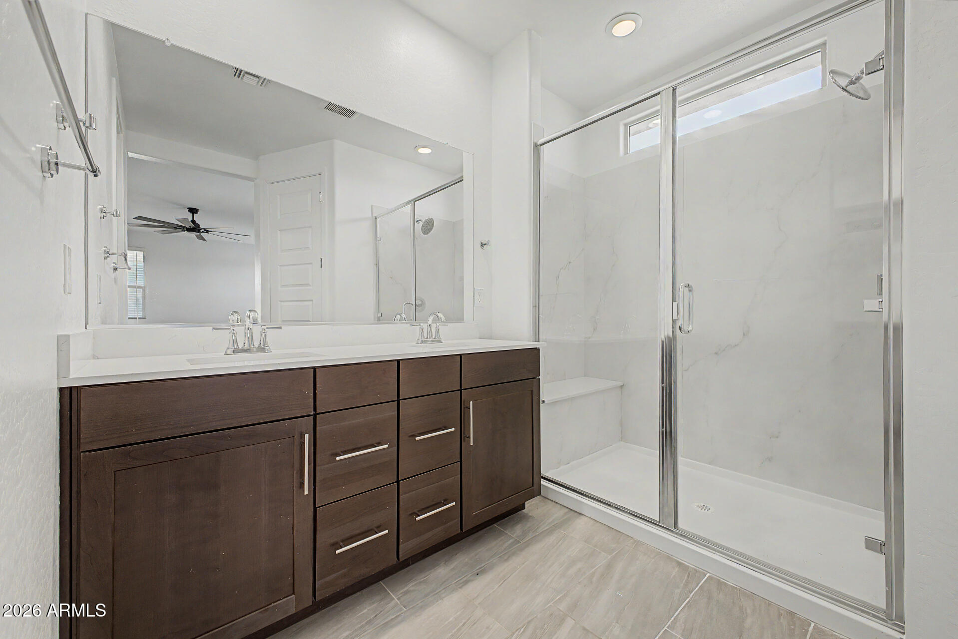 23080 East Stacey Road Queen Creek, AZ 85142 - Photo 20 of 42 a bathroom with a shower sink and mirror