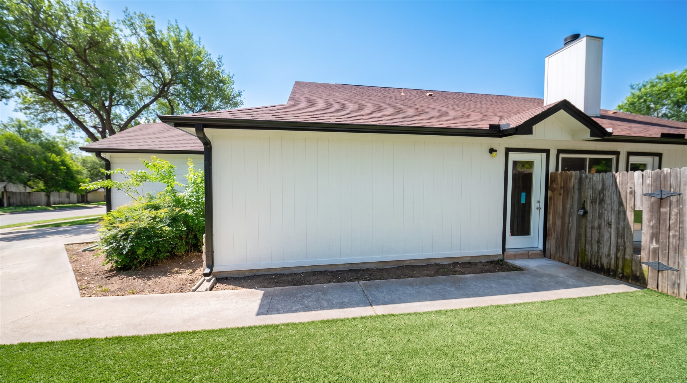 339 Fantail Loop, Unit B Austin, TX 78734 - Photo 7 of 21 a front view of a house with garden